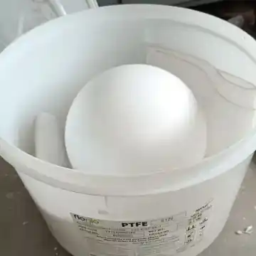 Large PTFE ball packed in labeled industrial bulk container